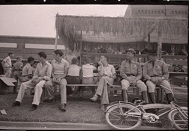 Crowley Louisiana National Rice Festival 1940s Men on Bench Bicycle FSA
